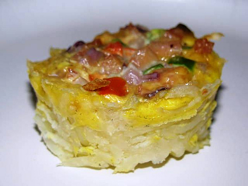 Individual ham, cheese, and vegetable frittatas.